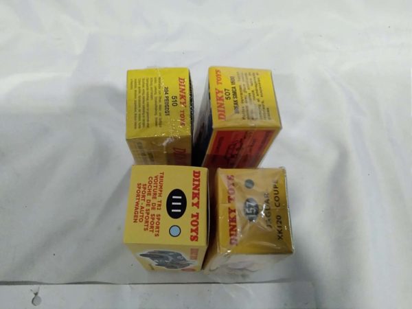 lot 169 4 modern Dinky cars still sealed - Image 4