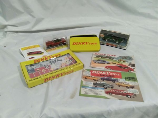 lot 174  Dinky model cars, booklets, accessories