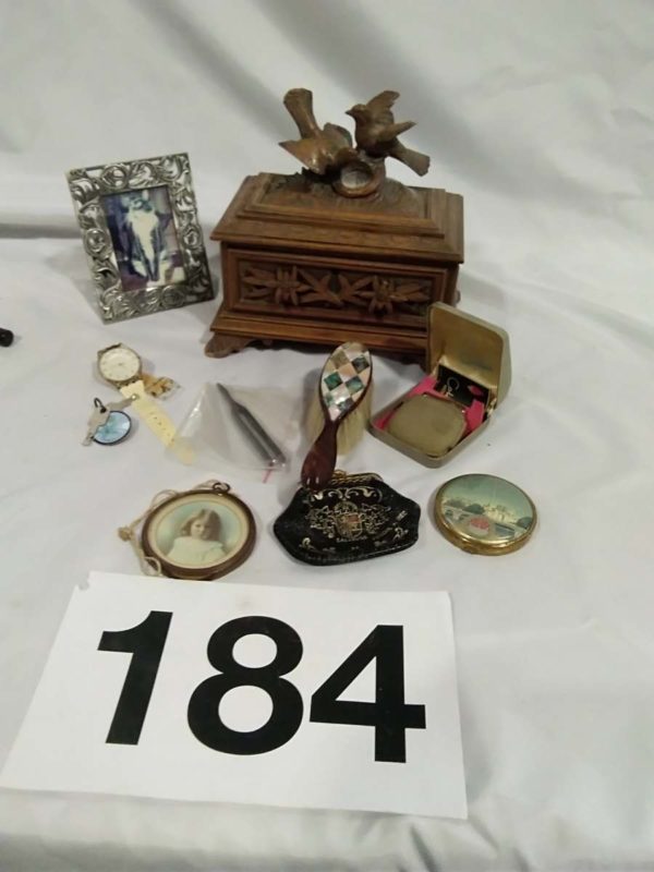 lot 184 various curios including compact, lighter and a hand carved wooded padded box (damage to wing of dove), etc.