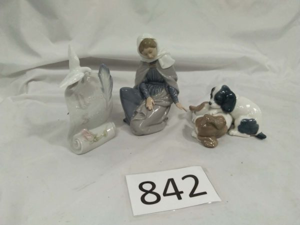 lot 842 Lladro & NAO ornaments, dogs, mary & scroll