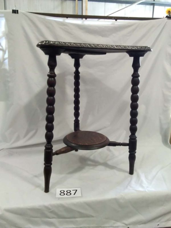 lot 887 carved Triangular table