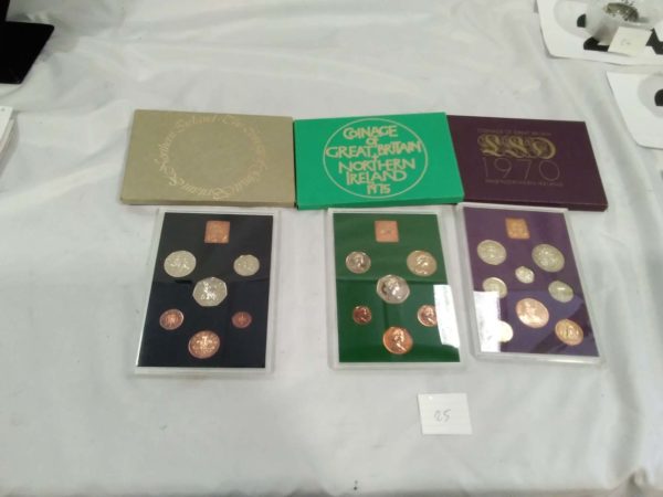 lot 025 Royal mint annual coin sets – 1970, 1975 & 1976