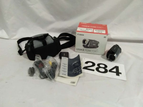 lot 284 Canon legria FS200 camcorder c/w book, leads, cast, etc. (no charger)