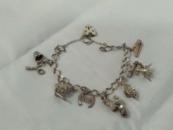 lot 466 sterling silver charm braclet & 8 charms