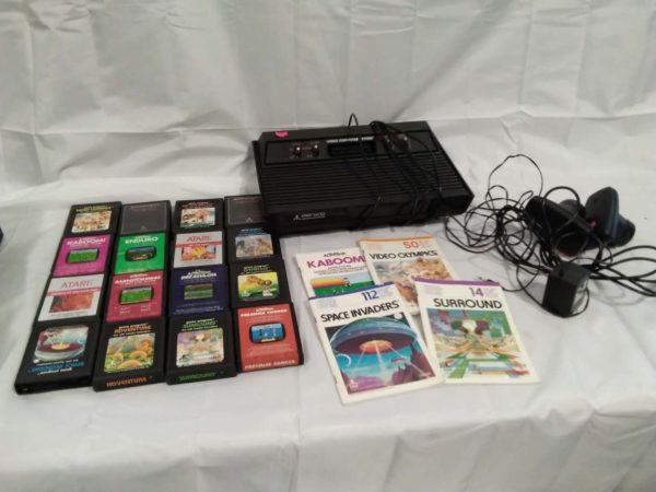 lot 061 Atari 2600 videal computer system with 2 paddle controls & adapter (untested) with 16 games & 4 manuals