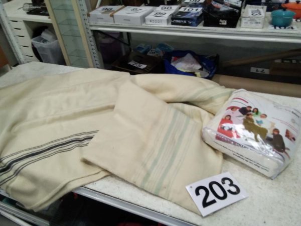 lot 203 woolen blankets ( stained) & modern blanket