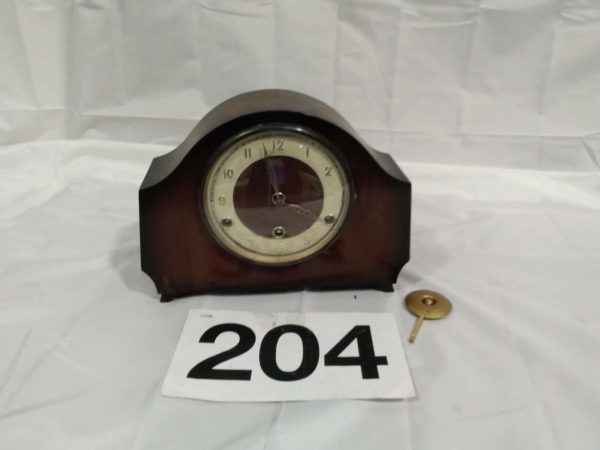 lot 204 wooden cased mantle clock ( no key)