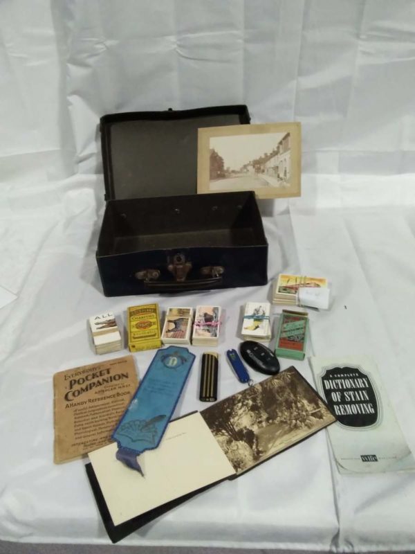 lot 265 1940’s evacuee case inc cigerette cards, ronson lighter & ephemera