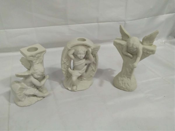 lot 239 trio cherub candle holders