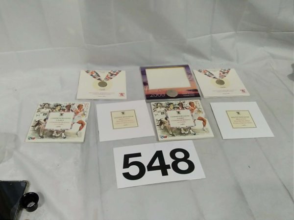 lot 548 3x Royal Mint coin packs – 1986 x2 & Millenium £5