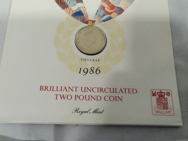 lot 548 3x Royal Mint coin packs – 1986 x2 & Millenium £5 - Image 7