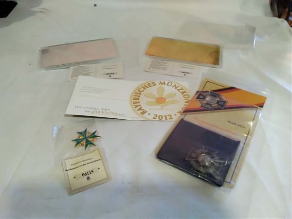 lot 045 replica badges, notes cased in Perspex