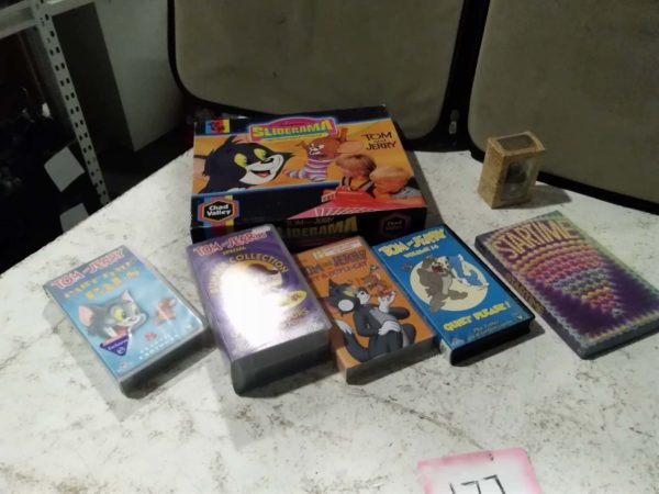 lot 177 various games & videos including Tom & Jerry, Lord of the Rings figure, etc.