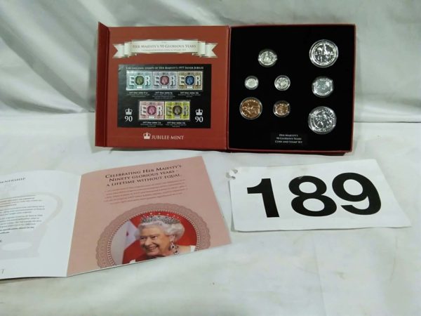 lot 189 Her Majesty’s 90 glorious years coin & stamp set