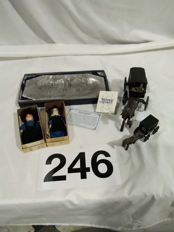 lot 246   Amish relted items – dolls, metal plate, figures