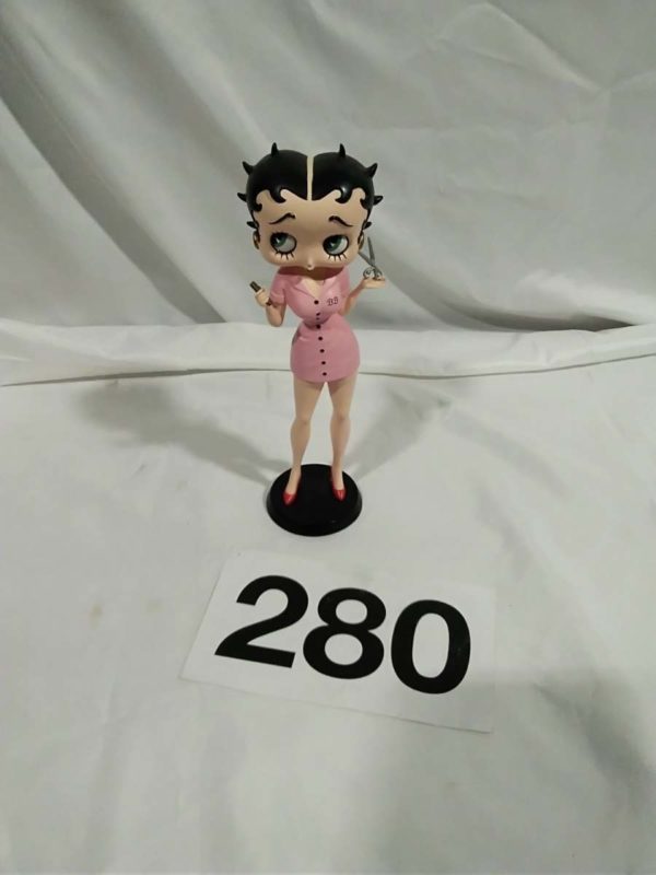 lot 280 Betty Boop standing with scissors in her hand