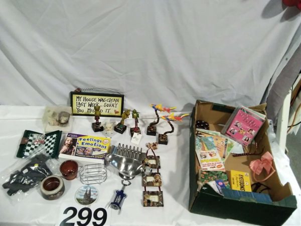 lot 299 miscellaneous ornaments, games & a “my house was” Sign