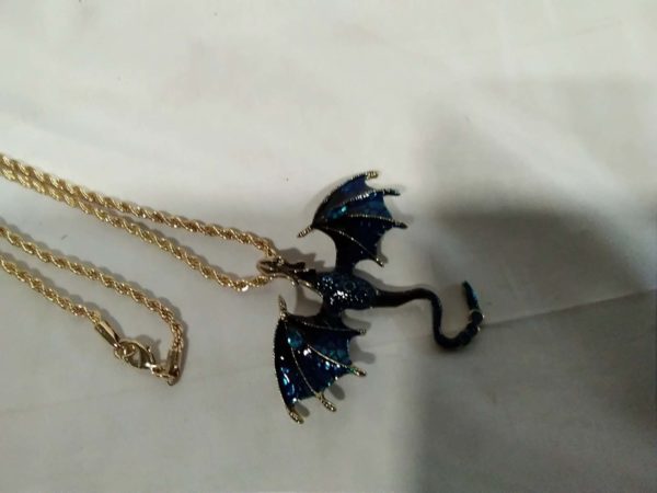 lot 370 blue flying dragon pendant with gold tone chain