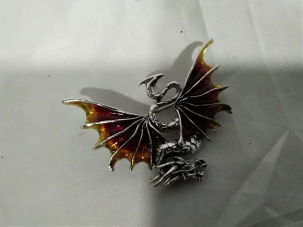 lot 374 amber coloured enamel flying dragon brooch /pendant