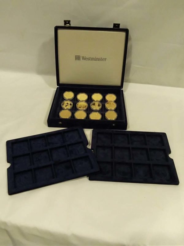 lot 555 royal themed cased coins in presentation box & empty trays