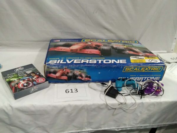 lot 613 Silverstone Scalextric complete with cars advengers books and PS controllers