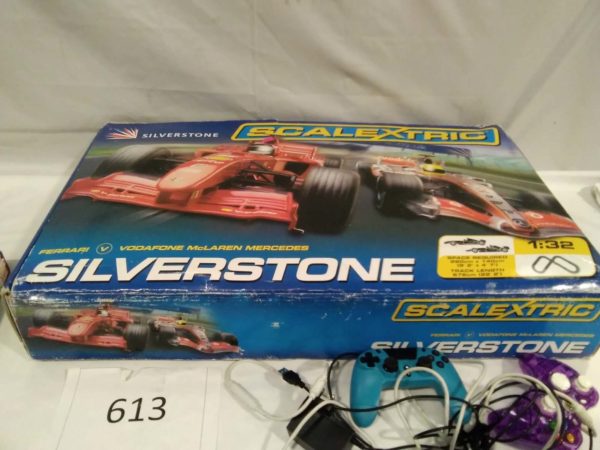 lot 613 Silverstone Scalextric complete with cars advengers books and PS controllers - Image 6