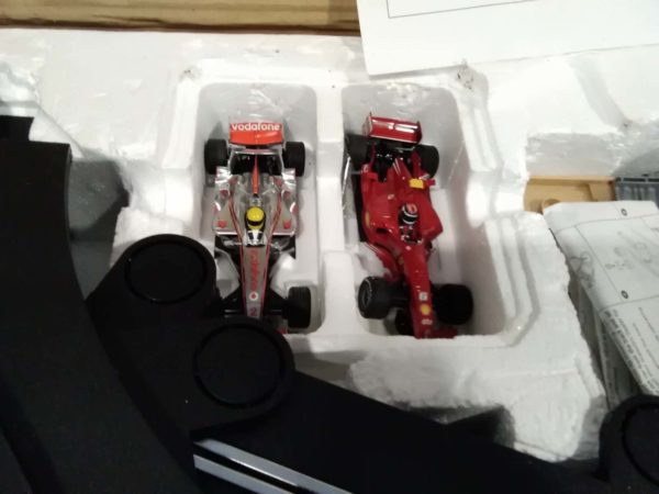 lot 613 Silverstone Scalextric complete with cars advengers books and PS controllers - Image 4