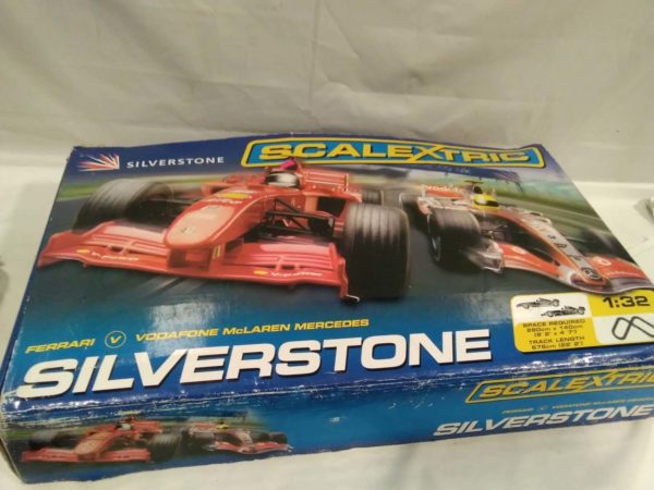 lot 613 Silverstone Scalextric complete with cars advengers books and PS controllers - Image 7