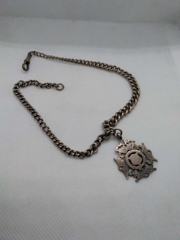 lot 645 Antique sterling silver Albert chain with medal