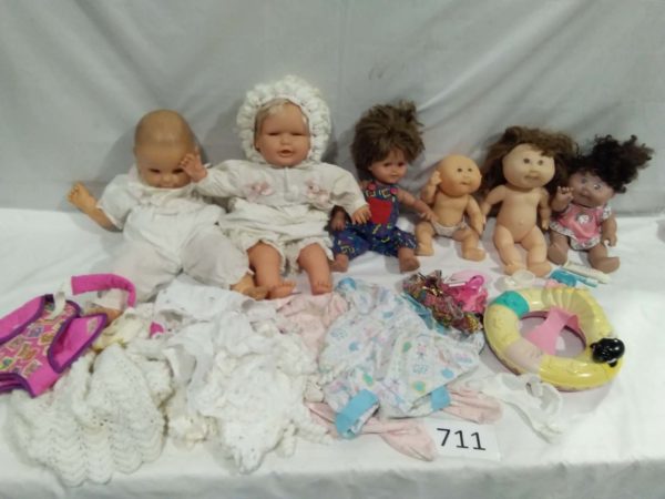 lot 711 Vintage Tiny Tim, Cabbage patch dolls with accessories, etc.