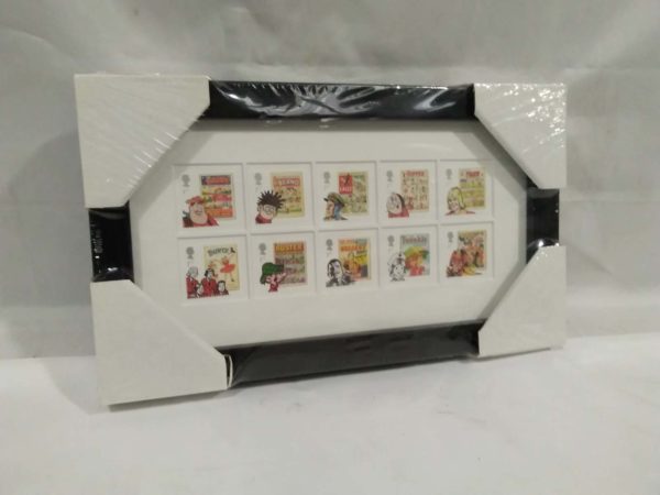 lot 799 Comics stamp issue 1012 framed stamps ( cellophane wrapped still)