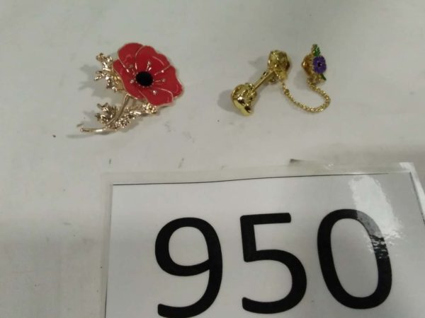 lot 950 large poppy brooch & a tie pin