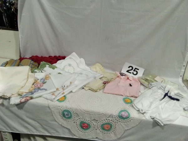 lot 025 polo shirt, Laura Ashley material, vintage baby dresses, crochet cloth, beach mats, etc.