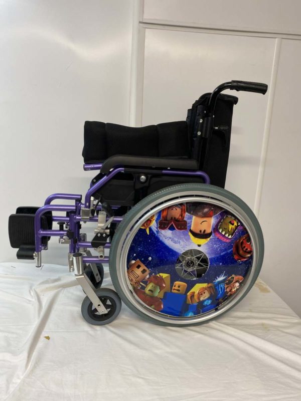 LOT NJ1036- CHILDS WHEEL CHAIR