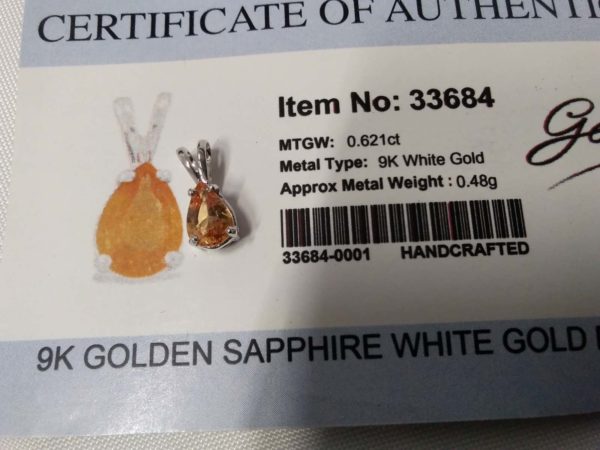 lot 224 9ct white gold pendant – golden sapphire – COA