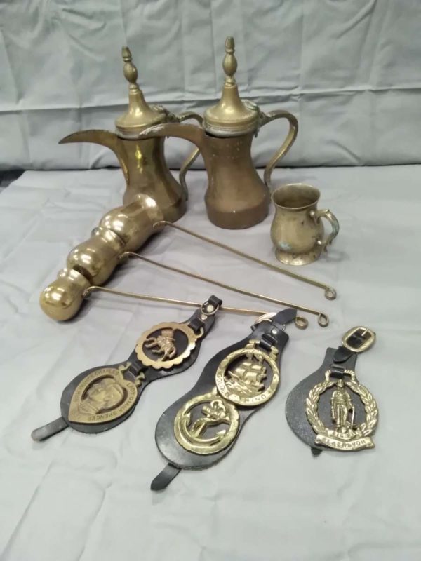 lot 324 horse brasses, brass spirit measures/ warmers, tea pots